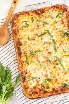 a casserole dish with cheese and herbs