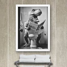 a black and white photo of a dinosaur sitting on a toilet reading a newspaper in a bathroom