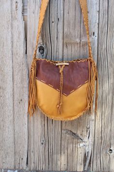 A handmade leather drum bag for your hand drum or just a large crossbody handbag. It is made in saddle tan leather with rust overlays. This bag measures 14" wide, 14" tall and 3 3/4" wide. The comfortable strap is 48" long. Let us know how long you like your strap. Crossbody or under the arm, however you like it. This item is MADE TO ORDER. Please read our policy on made to order items. Made to order items: Please allow 3 to 4 weeks to ship, sometimes sooner. You will not receive the piece you s Antler Buttons, Medicine Pouch, Clutch Purse Black, Hand Drum, Medicine Bag, Leather Hide, Designer Handbag, Leather Work, Crossbody Tote