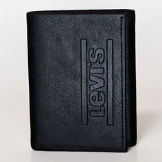 Levi's Wallet RFID Identity theft protection31LP110034 BLACK This wallets has built-in RFID lining that protects your data from theft. Made of Coated Leather wallet. Measures 4.50 x 3.50 x .75 inches when closed.6 Card slots, 2 Slip pockets 1 Currency compartment.Clear ID window with thumb ejector.Coated Leather tonal stitching Interior textile liningContrast logo details at front. Black Trifold Wallet For Business, Black Trifold Wallet With Coin Pocket, Black Rectangular Trifold Wallet With Rfid Blocking, Black Trifold Wallet With Rfid Blocking, Black Rfid Blocking Trifold Wallet, Black Leather Trifold Wallet With Id Window, Black Classic Trifold Wallet, Interior Textile, Interior Textiles