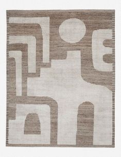 a beige and white rug with an abstract design