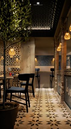 the interior of a restaurant with tables and chairs, lights hanging from the ceiling and tiled floor