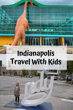 a kid standing in front of a giant dinosaur statue with the words indianapolis's travel with kids on it