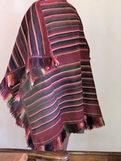 "Bolivian Poncho Tarabuco , province of Yamparáez in Chuquisaca. 47\" wide with a 3\" fringe and 35\" lond with the 3\" fringe This ethnic group lives southeast of Sucre, in central Bolivia, and represents one of the country's prominent traditional cultures. Throughout the centuries Tarabuqueños have woven their own clothes using distinct weaving patterns. Tarabuco men are recognizable by their k'uychis, ponchos woven with rainbow-patterned stripes - the tones of these stripes indicate the place Traditional Fringe Poncho For Fall, Traditional Fall Poncho With Fringe, Traditional Fringed Poncho Shawl, Guatemalan Weaving, Woven Art, Weaving Art, Weaving Patterns, Bolivia, The 3