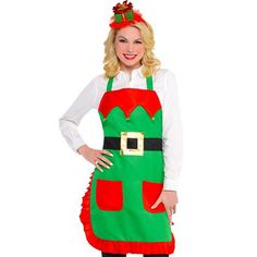 a woman wearing an apron and santa clause hat is standing with her hands on her hips