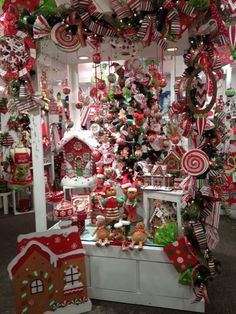 a christmas display in a store filled with lots of holiday decorations and candy canes