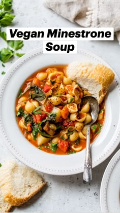 a bowl of vegan minestone soup with bread on the side