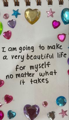 a note written on a notebook with hearts and stars around it that says, i am going to make a very beautiful life for my self no matter what it takes