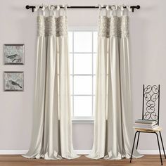 the curtains in this room are white and have ruffled trims