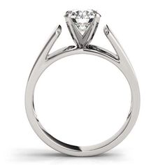 a white gold engagement ring with a single diamond on the top and two clawed shoulders