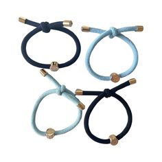 fashion meets function with our hair ties that look great on your wrist and in your hair! Sold as a set of 4 each hair tie has a double knotted design with our signature gold jewel detail ends. With a variety of color options you will find yourself adding this easy accessory for every occasion.  Blue Set consists of: Navy , Light Blue , Sky Blue , and Cream Each hair tie includes a 14K gold plated end and acrylic rhinestone. Water resistant - please avoid chemicals and/or other perfumes that can Light Blue Sky, Jewel Design, August Birthstone Jewelry, July Birthstone Jewelry, Gifts For New Mums, Jewelry Ring Box, Pearl Jewellery Earrings, Men's Jewelry Rings, Tie Set