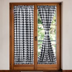 black and white checkered curtains in front of a window