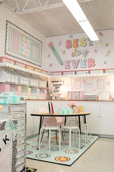 the interior of a children's playroom with desks, chairs and toys