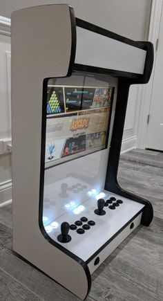 an arcade machine that looks like it is made out of cardboard