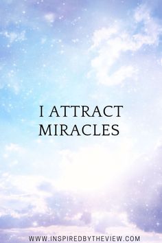 the words i attract miracles against a blue sky