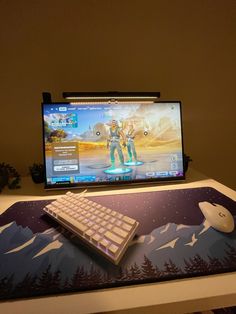 a keyboard and mouse sitting on top of a desk next to a computer monitor with a video game screen in the background