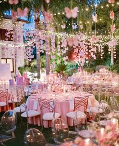 the tables are set with pink and white linens