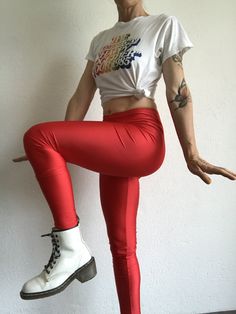 "Vintage leggings by Leonard , Model : Marius Made in Italy. 1980 Bright red leggings in shiny strech. High waist . Label of brand inside and original cardboard labels are present. Deadstock item.. In perfect condition. 80% Nylon 20% Elastam Size 2 Model wears usually size S (36/38) and measures 170cm / 66,8\" Flat measurements (without streching) : Size 2: Waist: 36cm - 14,1\" Hips: 40cm - 15,7\" Crotch: front: 29cm - 11,4\" rear: 33cm - 12,9\" Length: 98cm - 38,5\" Inseam: 75cm - 29,5\" Thighs Red High Stretch Bottoms For Party, Red Stretch Footless Bottoms, High Stretch Red Bottoms For Party, High Stretch Red Party Bottoms, Red Tight Full-length Leggings, Red Stretch Retro Bottoms, Red Retro Stretch Bottoms, Red Full-length Leggings For Party, Red Full Length Leggings For Party