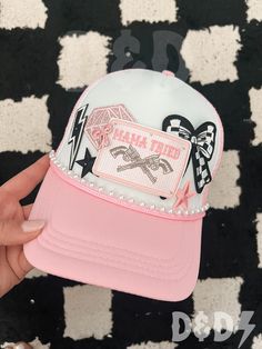 This custom made trucker patch hat is perfect for any occasion whether it be for spring/summer time, a lake hat, a gift for someone, or just a cute accessory to add a little spice to your outfit 🧢✨ DETAILS-  * This hat is one size with an adjustable SnapBack that is adjustable from 20in. - 23.5in. * The color of this hat is Light Pink & White but is available in many colors. * The material of the hat is polyester with iron on patches  NOTICE OF NON-AFFILIATION AND DISCLAIMER: We are not affiliated, associated, authorized, endorsed by, or in any way officially connected with the brand shown or any of its subsidiaries or its affiliates. All related names, marks, emblems and images are registered trademarks of their respective owners. These are not official merchandise. REFUNDS AND CANCELLAT Mama Trucker Hat, Custom Trucker Hats Patches, Hats With Patches, Trucker Hats With Patches, Hat With Patches, Lake Hat, Iron Patches, Pink Trucker Hat, Camo Trucker Hat