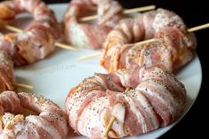 bacon wrapped pretzels are arranged on skewers