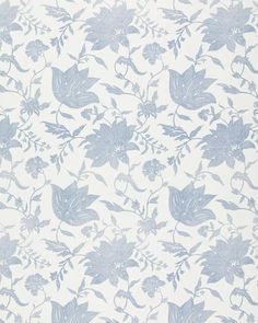 a blue and white wallpaper with flowers on it