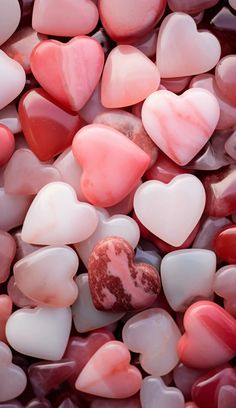 heart shaped rocks are shown in pink and white colors