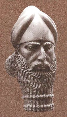 an old photo of a bust of a man wearing a turban and beard