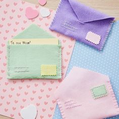 two envelopes, one with a card and the other with some felt hearts on it