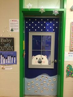 a door with a polar bear painted on it and the words baby is coming outside