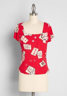 This retro-chic fitted top from UK brand Collectif features a print of a scattered deck of ivory-hued playing cards that feature cute white cats holding court as king and queen, and a white mouse as the joker amidst white paw prints throughout. Made from a vibrant red, stretchy viscose fabric, this vintage-inspired shirt boasts a square neckline, short flutter sleeves, and a shirred panel at the back waist for an easy, flattering, fitted silhouette that you’re going to love. Deal with it ! Visco Cute White Cats, Aries Outfits, Plus Size Vintage Clothing, Red Cards, Designer Plus Size Clothing, 1940s Woman, Cute Red Dresses, White Mouse, Red Dress Women