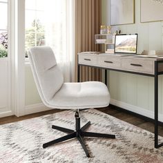 a white chair sitting on top of a rug next to a desk