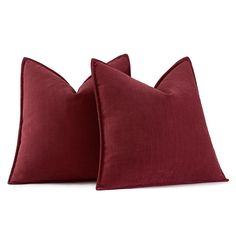 two red pillows sitting next to each other