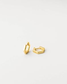 Have a geometric moment with these gold huggie hoops—an elevated staple with endless stacking potential! Crafted in gold vermeil with a hinged closure for easy everyday wear. There’s never been a better time to reshape your stack. Note: these earring posts are slightly thicker than our standard size and might fit a bit snug in your piercing. Yellow Gold Pierced Huggie Earrings In Brass, Small Gold Stainless Steel Huggie Earrings, Gold Geometric Hoop Earrings For Everyday, Geometric Gold Hoop Earrings For Everyday, Gold-tone Metal Huggie Jewelry, Gold-tone Gold Plated Pierced Huggie Earrings, Everyday Geometric Gold Hoop Earrings, Gold-tone Brass Elegant Huggie Earrings, Circle Jewelry