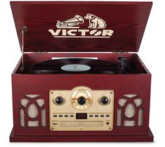 an old fashioned record player with the word victory on it's lid and side panel