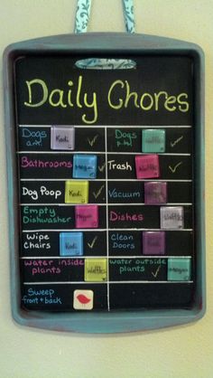 a chalk board hanging on the wall displaying daily chores