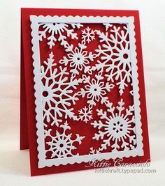 a red card with white snowflakes on it