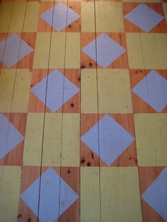 an orange and white checkered floor with some blue squares on it's sides