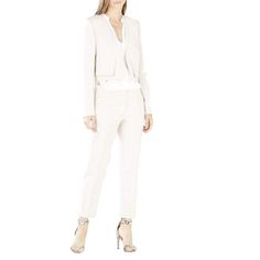 Perfectly tailored for timeless sophistication, this double-layered blazer effortlessly transitions from the office to after hours. Open front. Long sleeves. Double layer construction. Self: Polyester, Rayon, Spandex. Contrast: Rayon, Nylon, Spandex ponti. Lining: 1. Polyester. 2. Cotton poplin. Cropped silhouette. Fits true to size. Sleek Fitted Pantsuit For Spring, Sleek Fitted Spring Pantsuit, Tailored Structured Pantsuit For Office, Tailored Structured Office Pantsuit, Spring Professional Fitted Pantsuit, Sleek Structured Spring Suit, Fitted Structured Suits For Spring, Spring Office Blazer With Structured Boning, Spring Office Blazer Structured Fit