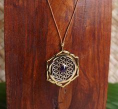 Flower of life necklace with padma and amethyst stone can be adjusted in length. Material : Brass, White Brass, amethyst stone,string Material of padma : Brass Material flower of life : white Brass Weight : 10 gram Height of pendant : 1.8 inches Width of pendant : 1.5 inches Ship wordwide from Ubud, Bali, Indonesia Spiritual Amethyst Round Pendant Necklace, Amethyst Gemstone Amulet Necklace, Spiritual Amethyst Pendant Necklace, Purple Amethyst Amulet Necklaces, Amethyst Amulet Necklace For Meditation, Purple Amethyst Amulet Necklace, Holistic Amethyst Gemstone Jewelry, Purple Gemstone Amulet Necklace, Spiritual Amethyst Necklaces With Adjustable Chain