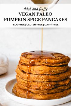 a stack of pumpkin spice pancakes with syrup on top