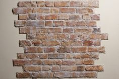 an old brick wall is shown in this image