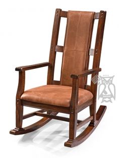 a wooden rocking chair with brown leather upholstered on the seat and backrest