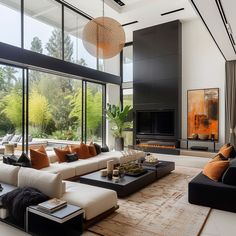 a modern living room with large windows and lots of furniture