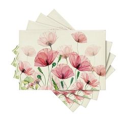 four napkins with pink flowers on them