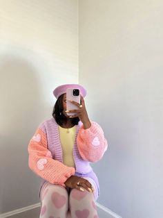 a woman taking a selfie with her cell phone wearing pink and white polka dot tights