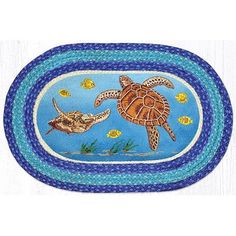 an oval rug with two sea turtles swimming in the ocean