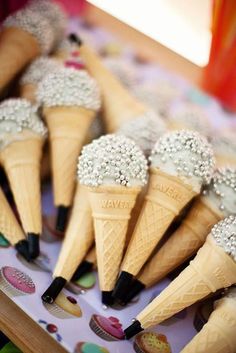 there are many cones with ice cream on them