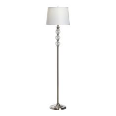 a floor lamp with a white shade on it