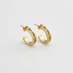 Elevate your style with these charming gold hoops adorned with hand-painted enamel delicate pink flowers. These earrings celebrate the fleeting beauty of spring, a perpetual bloom captured in a timeless design. Key features: Hand-painted enamel Hand-carved detailing 18K Worn-gold plated zinc alloy, enamel 5mm width band; 2mm thick-rounded; 16mm internal diameter Comes in a gift box with cotton pouch Hand Painted Jewelry As Spring Gift, Hand Painted Jewelry For Spring Gift, Hand Painted Jewelry For Spring, Spring Hand Painted Jewelry, Spring Yellow Gold Earrings Gift, Yellow Gold Earrings For Spring Gift, Spring Gift Yellow Gold Earrings, Irish Knit Sweaters, Tweed Purse