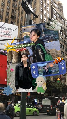 a woman standing next to a street sign in front of a tall building with lots of signs on it